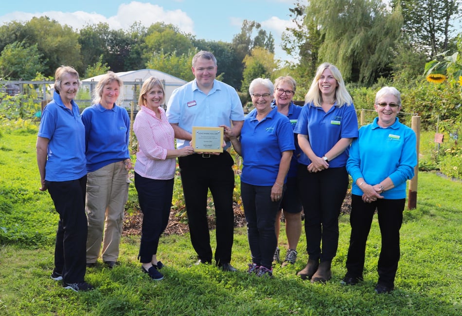 <p>Sarah Squire, chair of Squire’s Garden Centres (third from left) and Brian Phillips, Badshot Lea centre manager, with staff and volunteers from The Therapy Garden.</p>