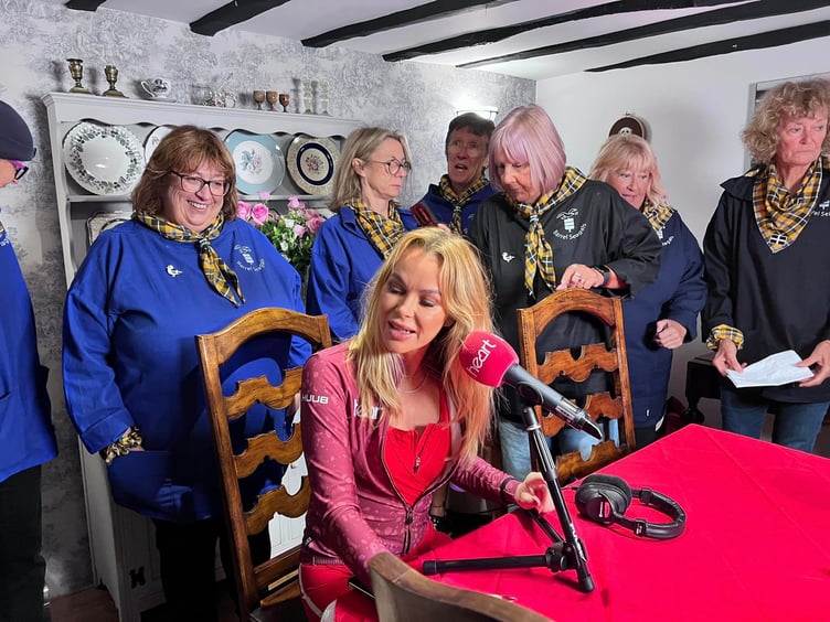 Amanda Holden broadcasting to the United Kingdom on Heart from Bude ahead of her bike run to London (Picture: Barrel Seagals)