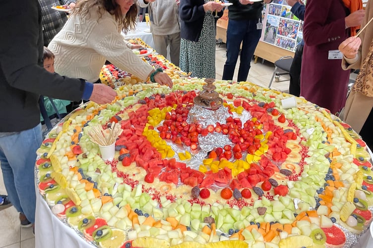 Chocolate fountain and fruits greet visitors before touring the site