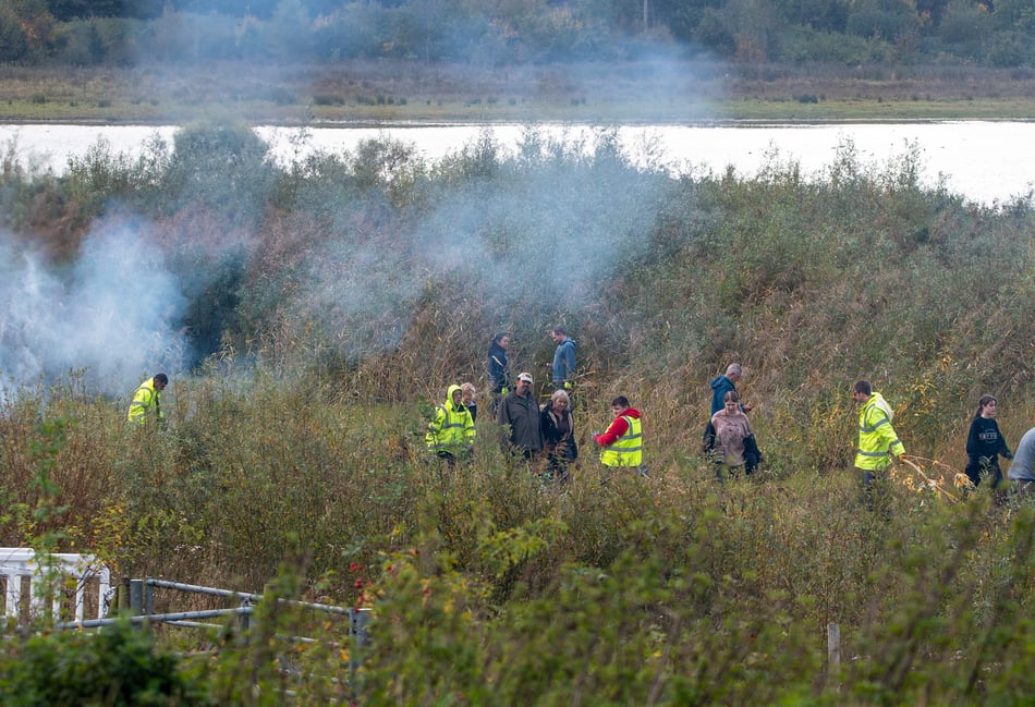 <p>A working party clears willow at Tice's Meadow</p>