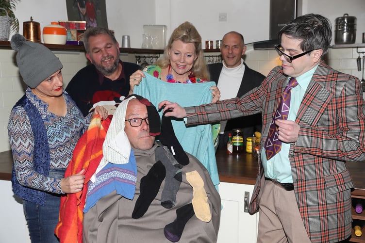 Absurd Person Singular, Grayshott Stagers, October 2024. Ronald (Eric Collins) is treated for shock by Jane (Jemma Jessup), Dick (Buff Cooper), Marion (Brezetta Thonger), Geoffrey (Richard Hosmer) and Sidney (Paul Baverstock).