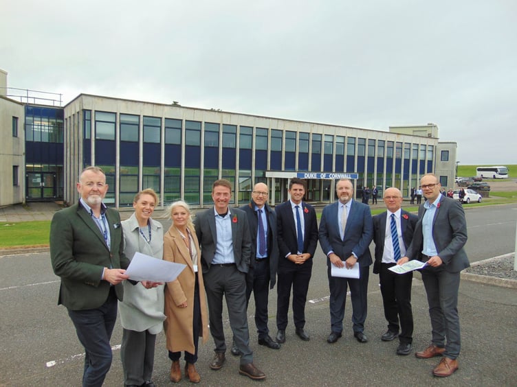 Reprentatives of RNAS Culdrose, Royal Navy Infrastructure, Kier Construction, Mott MacDonald and Defence Infrastucture Organisation inspect plans to demolish and replace the Engineering Training School
