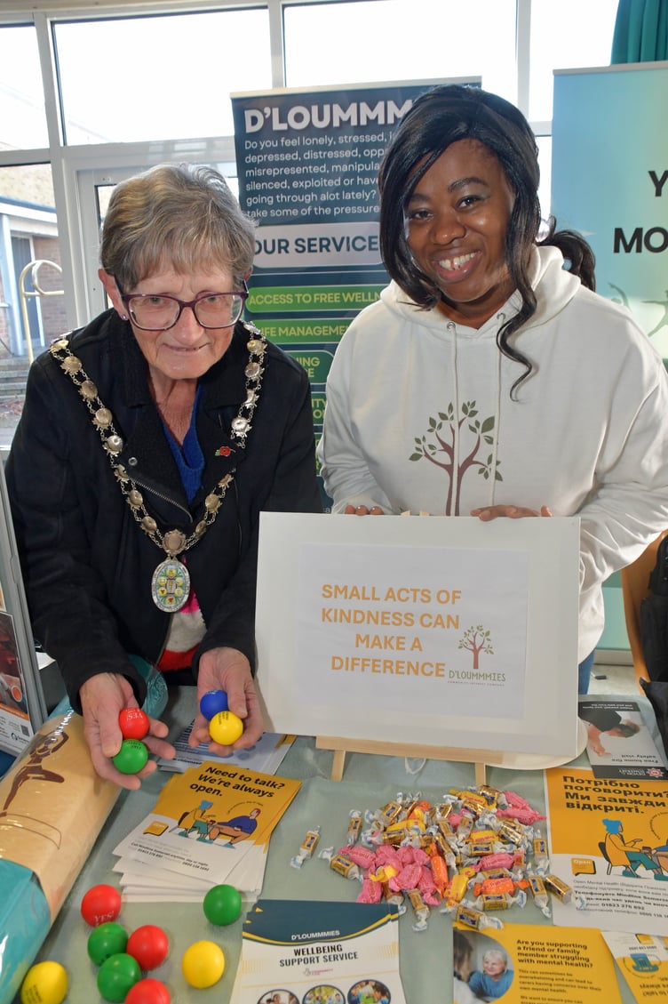 Town mayor Cllr Janet Lloyd (left) takes a look at the D'Loummmies wellbeing support service stall at Wellington Together.