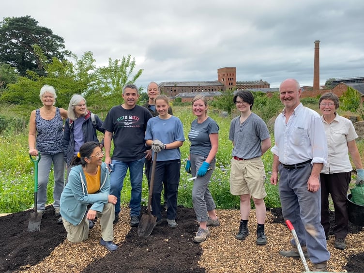 Transition Town Wellington chairman Anita Roy (kneeling) with a group of keen community gardeners in Fox's Field.