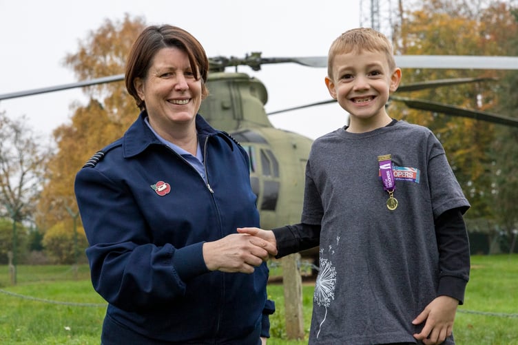 Wing Commander Jo Fields presents Teddy with the Little Troopers Award at RAF Odiham, November 2024.