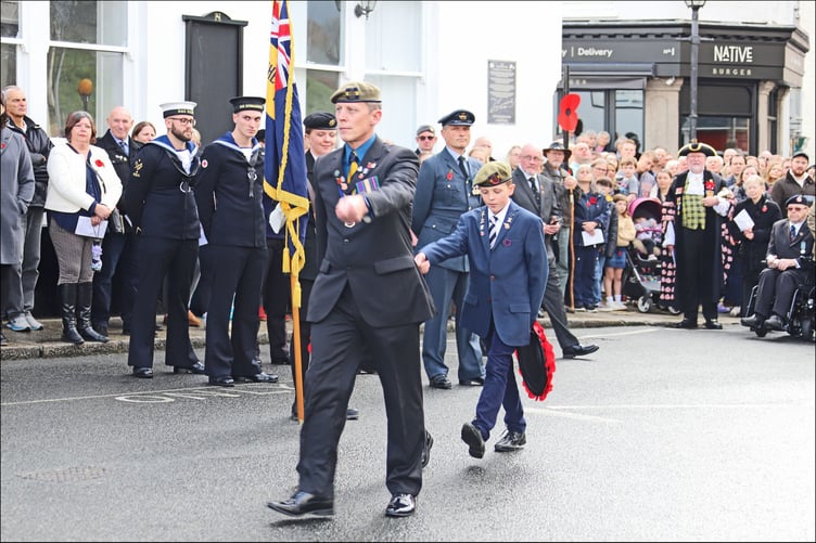 Launceston Royal British Legion branch chairman John Harrison and his son march up to the war memorial to lay wreaths. (Picture: John Ellacott)