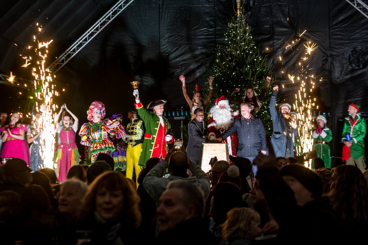 Farnham and Bordon MP Greg Stafford, Farnham mayor Brodie Mauluka and Santa push the button to illuminate the town in festive sparkle