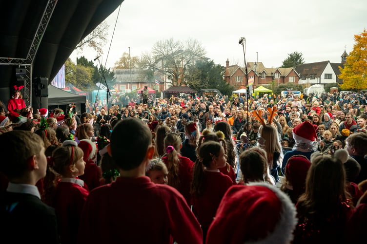 Children from Potters Gate and St Andrew's schools in Farnham showcase their angelic voices at the Christmas lights event.