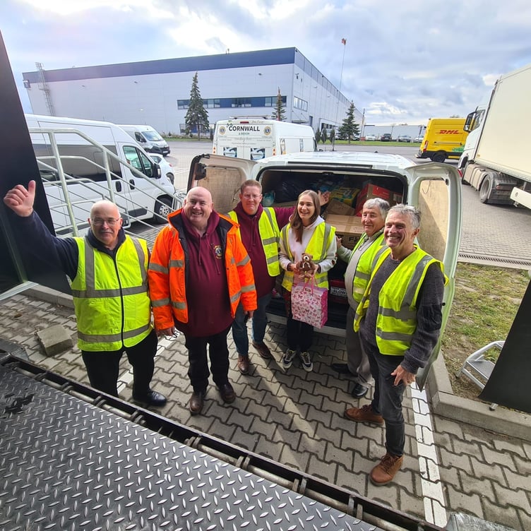 Members of the Tamar Valley Twinning Group hand over 87 shoeboxes to aid the people of Ukraine