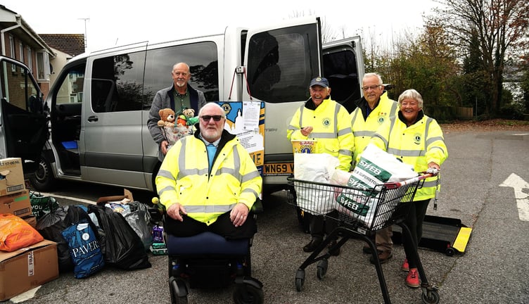 Members of the Torpoint and Rame Peninsula Lions with aid donated by shoppers for the people of Ukraine