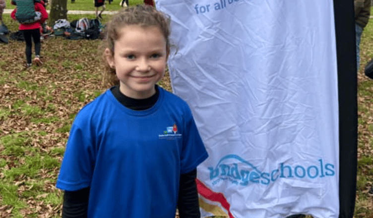 A happy Felicity from Duloe Primary School after competing in the latest Cross Country event at Lanhydrock