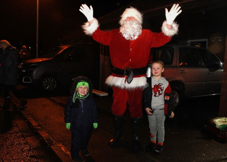 Father Christmas was guest of honour to switch on the festive lights in Minehead's Plover Close. PHOTO: George Ody.