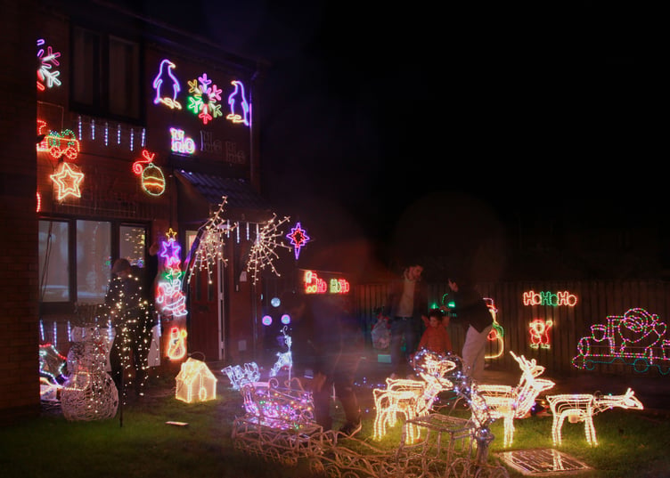 A family enjoy the Plover Close, Minehead, Christmas lights. PHOTO: George Ody.