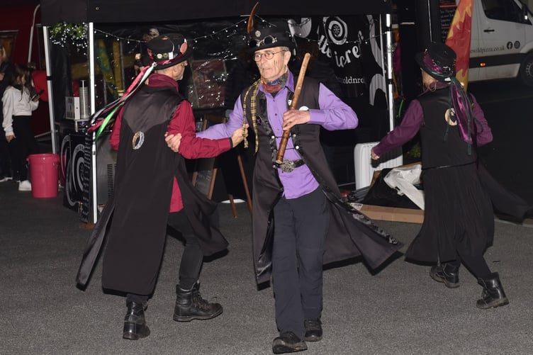 Members of Cat's Eye Morris perform at the Liskeard Lights Up Parade
