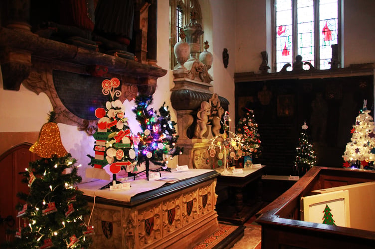 Three of the Christmas trees in St Decuman's Church, Watchet, (from left) by Watchet Rangers, Williton Beavers, and Williton Squirrels. PHOTO: George Ody.