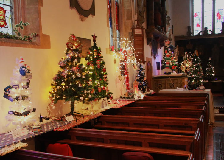 Watchet Girl Guides 'Polar Express' in the foreground of a row of entries in the St Decuman’s Church Christmas tree festival. PHOTO: George Ody.