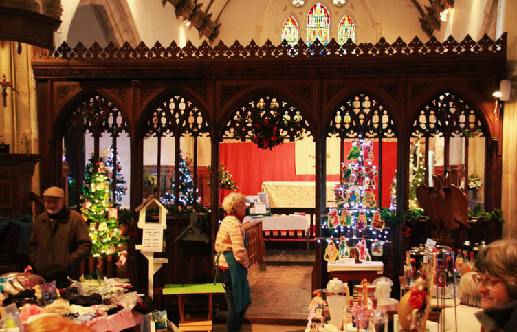 Visitors to St Decuman’s Church, Watchet, view the Christmas tree festival. PHOTO: George Ody.