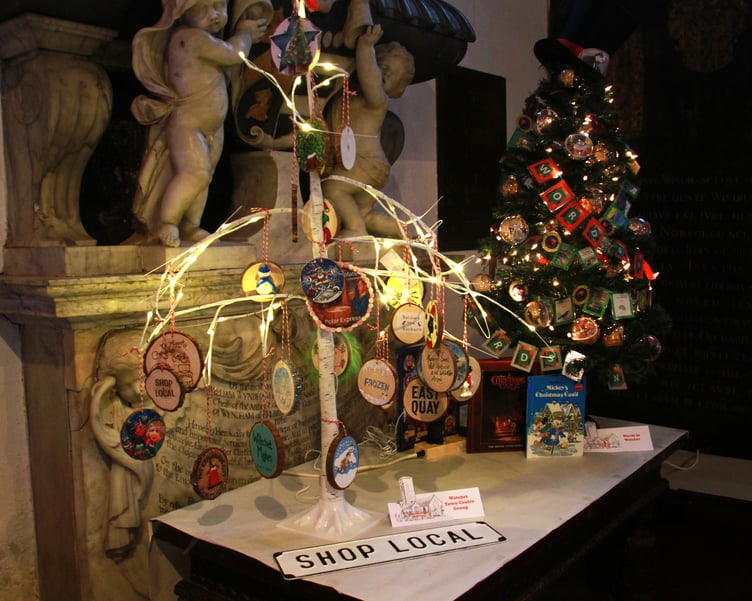 Watchet Town Centre Group promoted its 'Shop Local' message with an entry in St Decuman’s Church, Watchet, Christmas tree festival. PHOTO: George Ody.