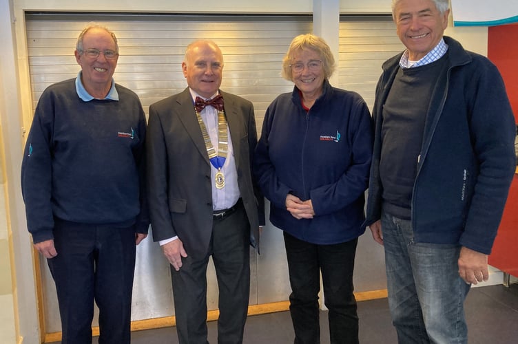 The Frensham Pond Sailability management committee of Ivor Barrett, Kate Whyatt and Simon Crowther with Farnham Lions president Simon Moran-Smith, December 4th 2024.