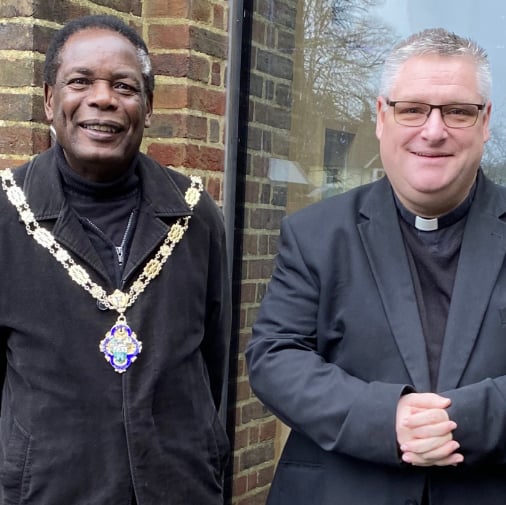 Farnham town mayor Brodie Mauluka and Father Simon Dray of St Joan of Arc Church.