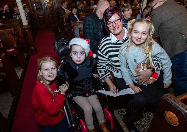 Bonnie, nine, who benefited from funds raised at the event, with her family. Picture: Paul Williams.