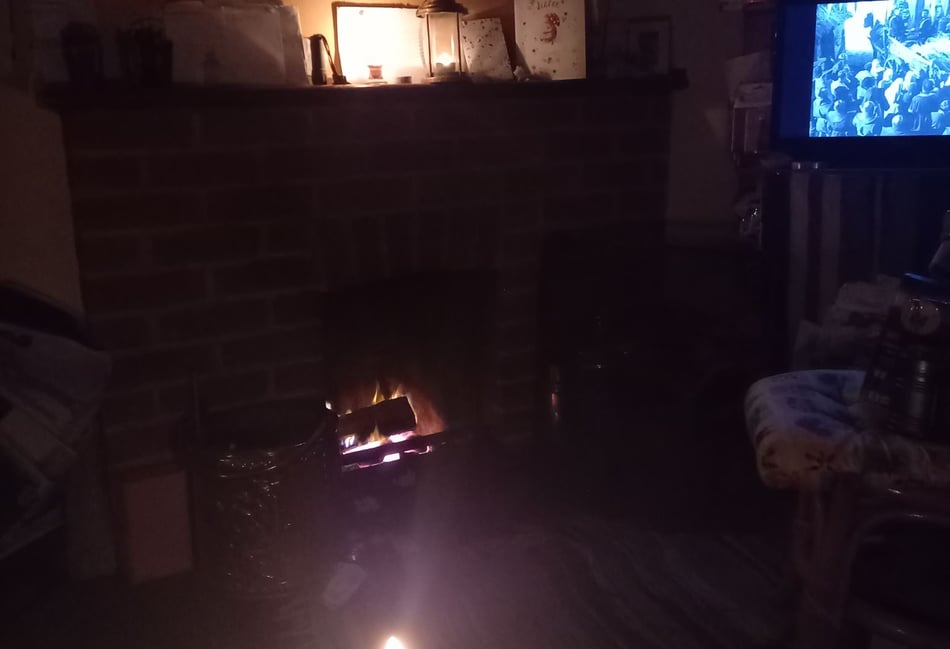 <p>Gwyneth Rushton's living room was illuminated by a candle and a collapsible lantern - yet the television stayed on!</p>
