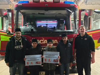 Muslim association distributes festive food to firefighters and police
