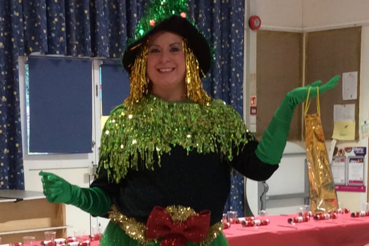 Alison Stone, here dressed as a Christmas tree, has left her role as headteacher of Folly Hill Infant Academy.