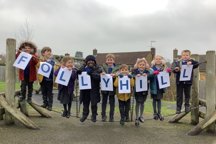Pupils at Folly Hill Infant Academy in Farnham celebrate their school's outstanding Ofsted report.
