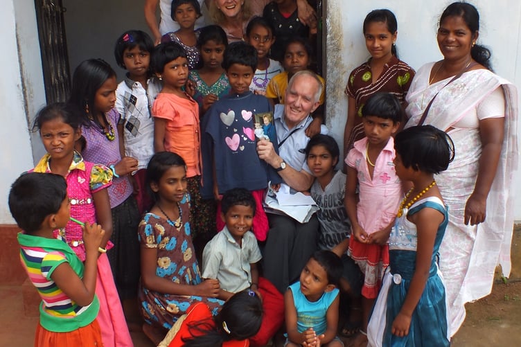 Robin Radley with children in Kerala, India.