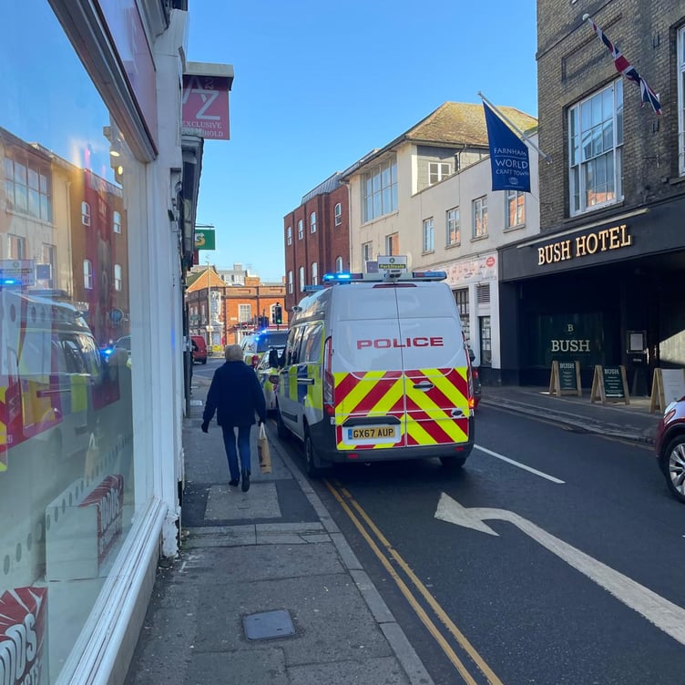 Police respond to the incident at Santander bank in The Borough, Farnham.
