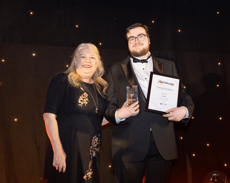 Apprentice Achiever of the Year winner Piers Smith collects his award from Julie-Anne Sunderland, Chief People Officer at category sponsors Wildanet