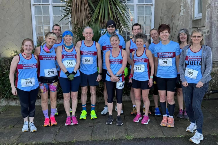 Farnham Runners pose in front of a palm tree before the Ryde ten-mile race