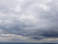 Partly cloudy skies with gentle breezes and low chance of rain