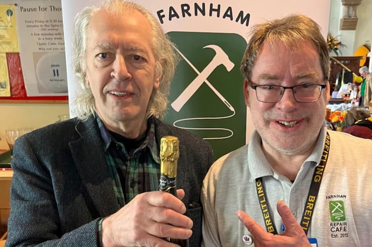 Paul Tiller, who is about the 6,000th visitor to the Farnham Repair Cafe, with chairman Martin Charter.