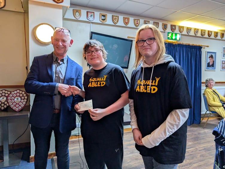 Young beneficiaries of Equally Abled, an activity and social group for young people with SEND receiving their cheque (Picture: Aaron Greenaway)