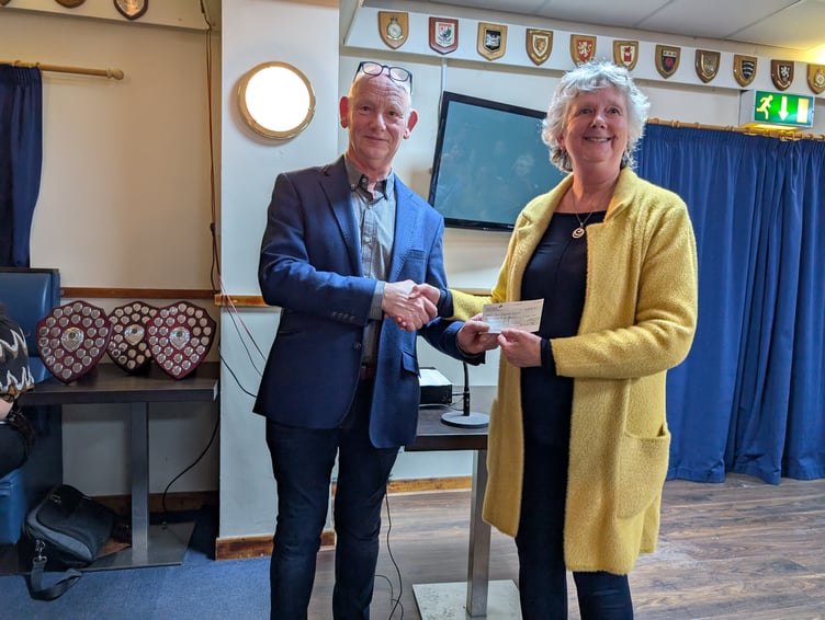 Carolyn Cooper, former mayoress of Bodmin being presented with a cheque for the Bodmin Christmas Lights Committee (Picture: Aaron Greenaway)