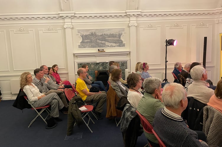The audience watch In Conversation with Sally Coulthard event at Farnham Literary Festival 2025.