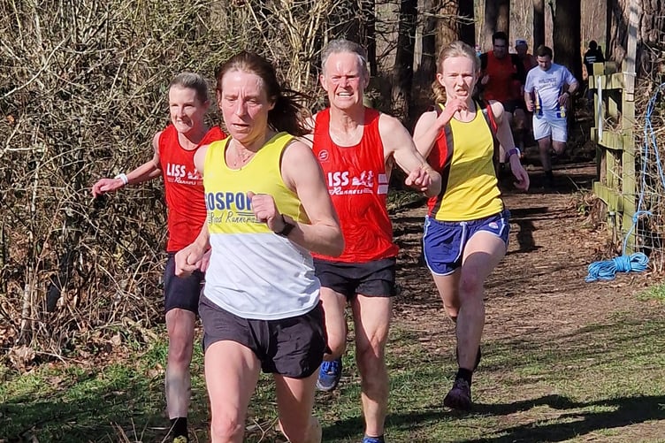 Liss Runners Anastasia Hounslow and James White sprint for the finish line