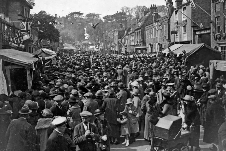 Although the exact date this wonderful photo of Castle Street was taken is unclear, there are several clues - from the funfair at the rear to the military band on the right, and the absence of young male faces in the crowd.