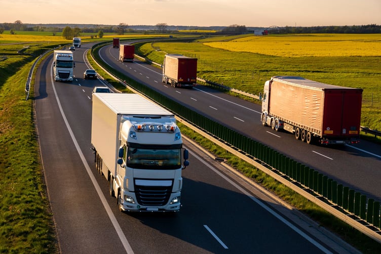 Heavy truck traffic on the highway in the evening