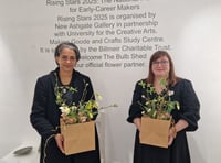 <p>Flowers for winner Makila Nsika and runner-up Zillah Puri (Photo: Outi Remes)</p>