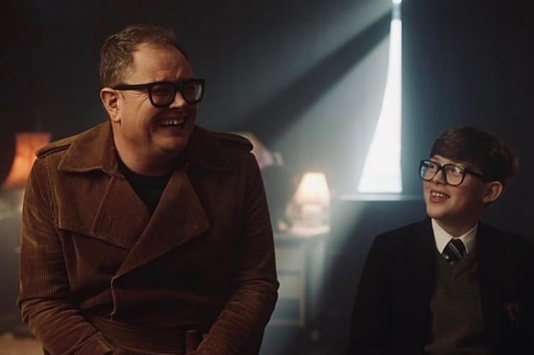 Alan Carr and Oliver Savell as Young Alan Carr