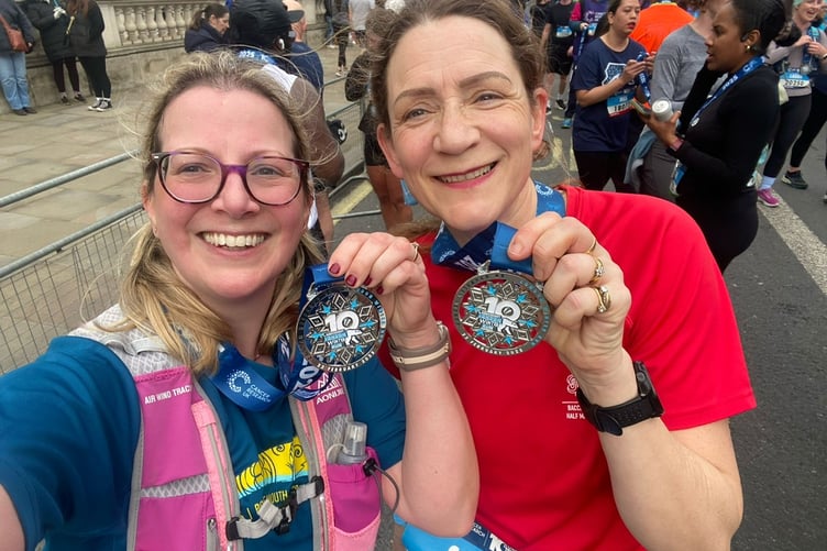 Showing off the London Winter 10km medals