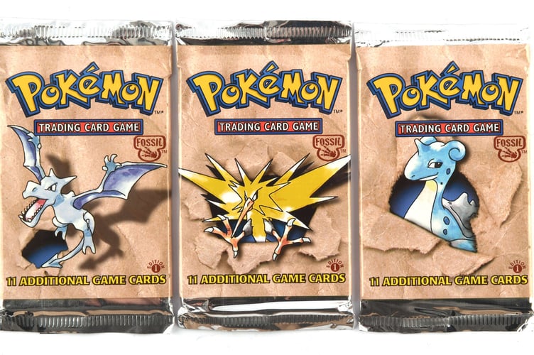 Pokemon TCG complete art set of Pokemon Fossil first edition sealed Booster Packs.