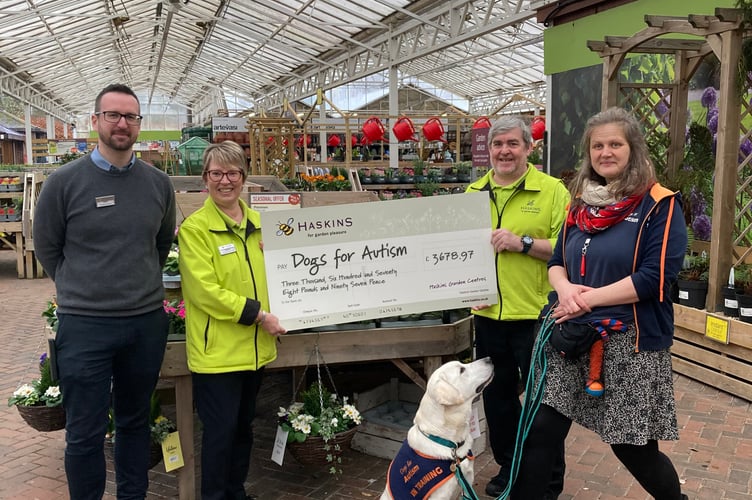 From left: Forest Lodge operations manager Sam Jones, Forest Lodge customer services team leader Sandra McGuigan, Forest Lodge sundries senior Philip Widdowson, Dogs for Autism trainer Santa Aumeistere and Jack the yellow Labrador, in training, Haskins Forest Lodge Garden Centre, Holt Pound, March 2025.