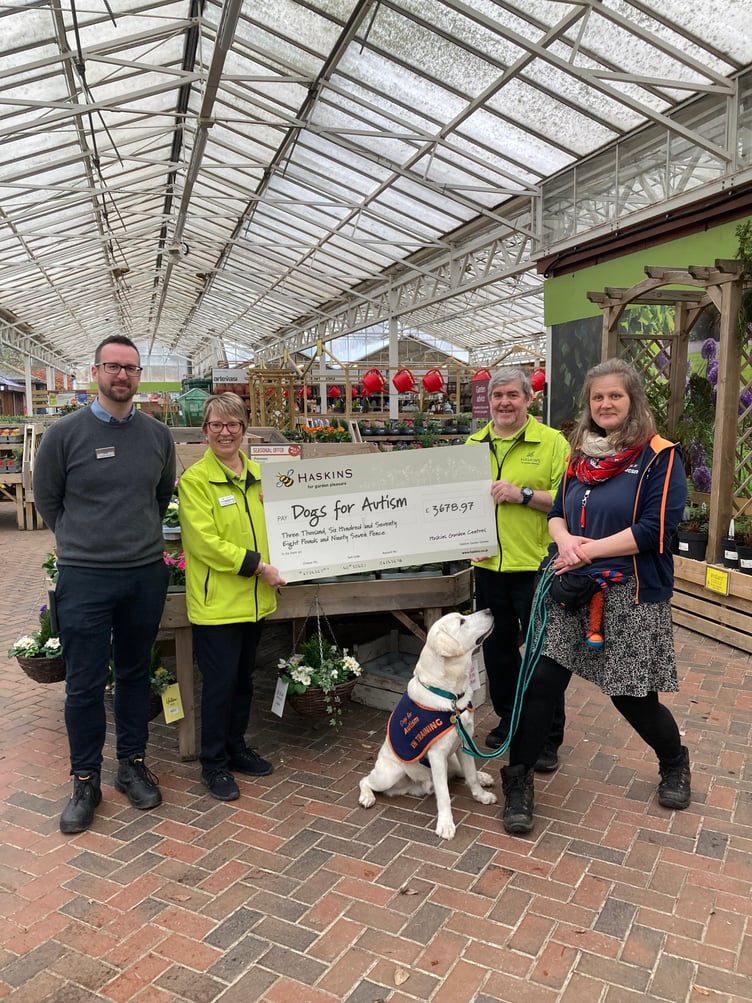 From left: Forest Lodge operations manager Sam Jones, Forest Lodge customer services team leader Sandra McGuigan, Forest Lodge sundries senior Philip Widdowson, Dogs for Autism trainer Santa Aumeistere and Jack the yellow Labrador, in training, Haskins Forest Lodge Garden Centre, Holt Pound, March 2025.