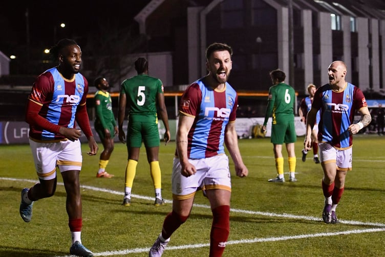 Sam De St Croix celebrates after scoring Farnham Town's opening goal
