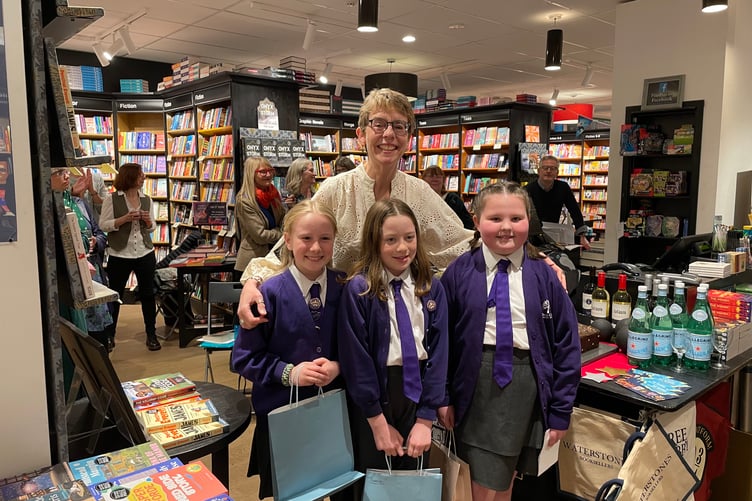 Children's author Ally Sherrick with competition winners Josie Gregory, Florence Wakely, and Lily-Jane Sharp from William Cobbett Primary School.