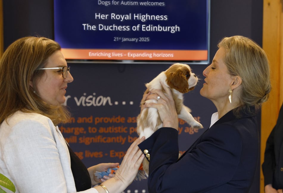 <p>The Duchess of Edinburgh with Louis, a puppy in training at the charity (Susie Kirkby)</p>